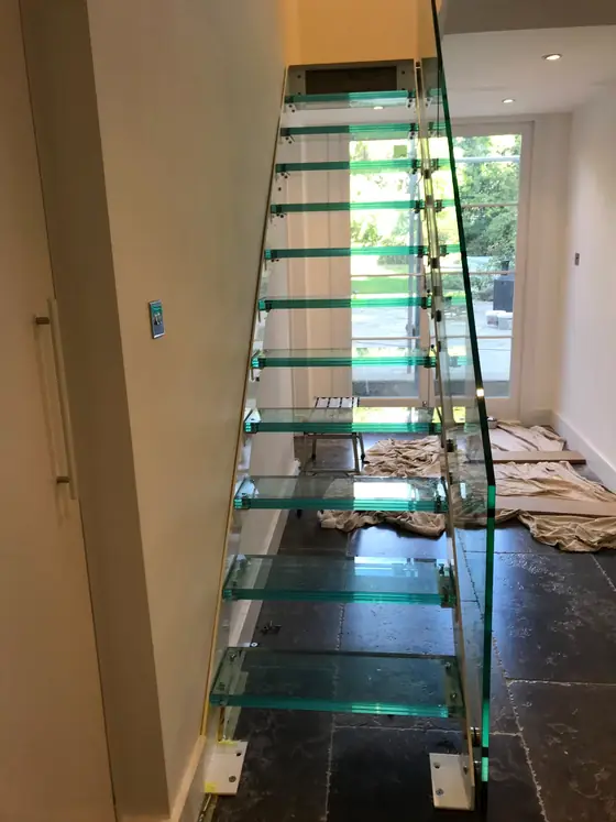 The same glass staircase and glass rail, seen from the side