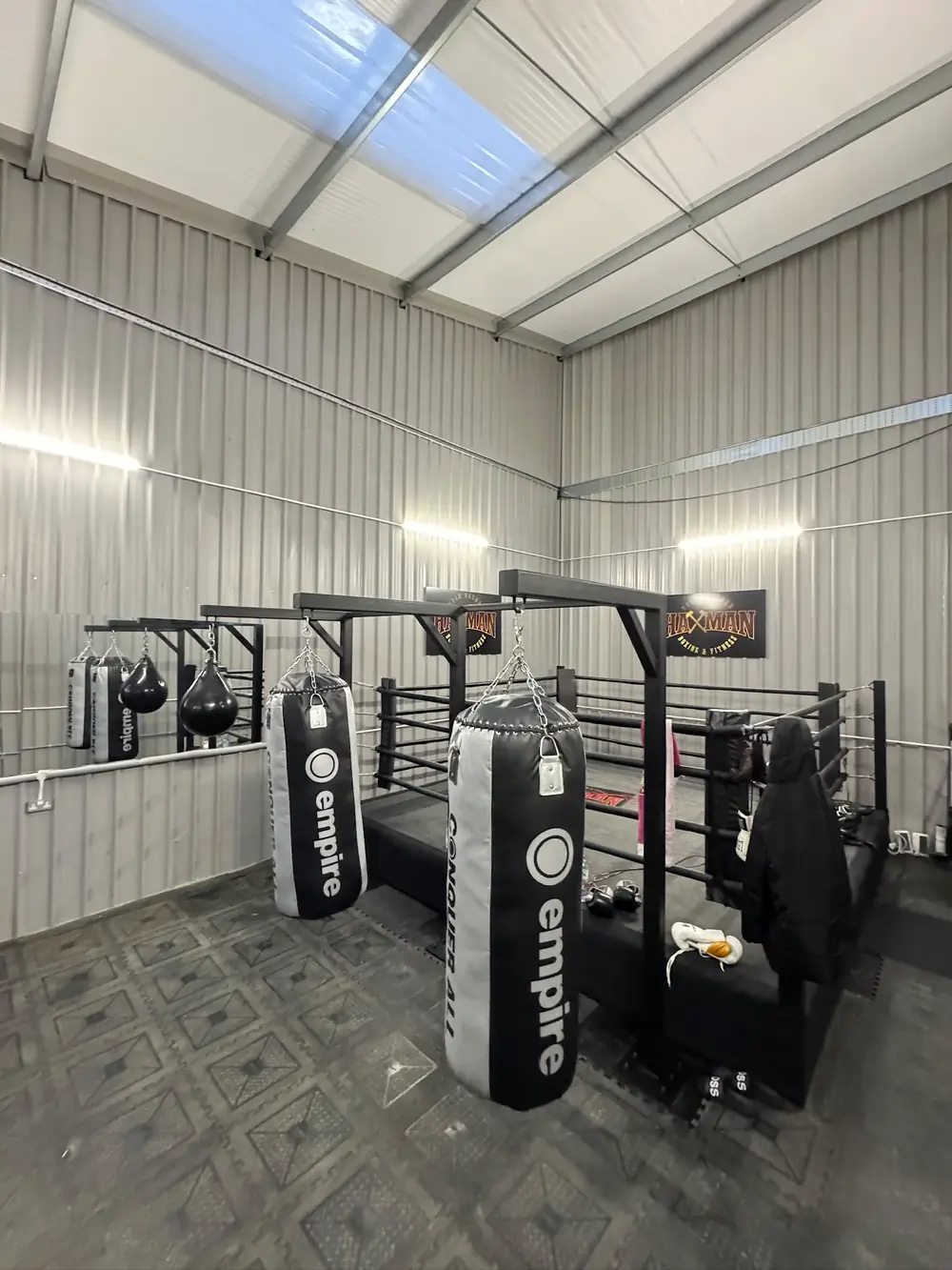 A one off steel gym frame with punchbags hanging from it