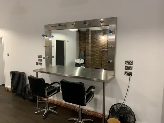 Stainless steel counters and a mirror frame, made for a salon